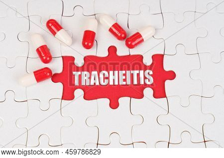 Medical Concept. There Are Pills On The White Puzzles, In The Middle There Is A Red Surface With The