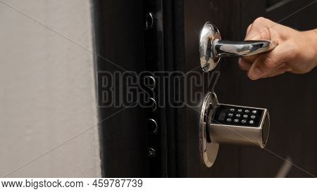 Woman Opens The Combination Lock On The Door To The Apartment. Keyless Entry.