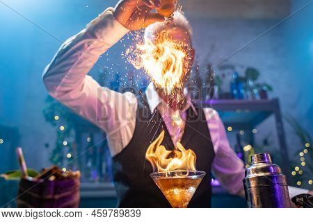 Bartender Making A Fire Flame Cocktail In A Elegant Night Club Party Unique Experience.