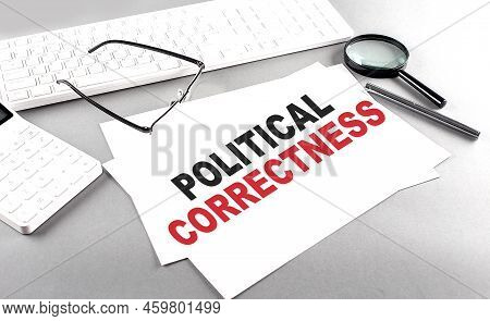 Political Correctness Text On A Paper On A Gray Background Near Calculator And A White Keyboard