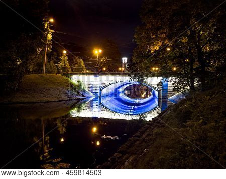 The Beautiful View On Bridge With Blue Illumination In Bastion Hill Park (bastejkalns) At Night In R