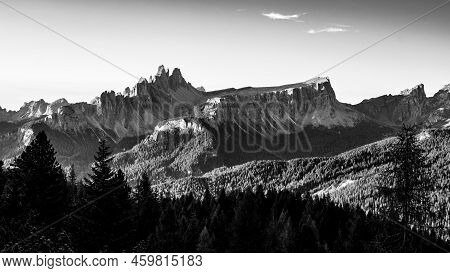 Dolomites Panoramic View At Morning Sunrise Time. Croda Da Lago Ridge. Italy. Black And White Image.