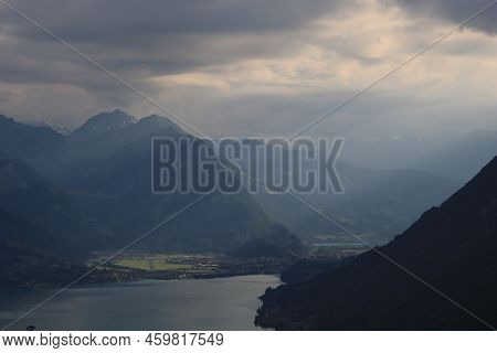 Sun Beams Enlighten The Runway Of A Small Airport In Interlaken.