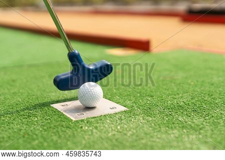 Mini-golf Ball On Artificial Grass. Summer Season Game