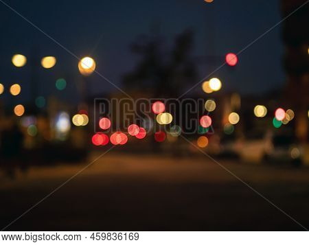 Blurred View On A Evening Crosstown Traffic With Traffic Lights. Defocused City Street View.