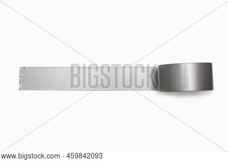A Spool Of Gray Duct Tape Is Unwound And Pasted To A White Background. Adhesive Tape For Repair Work