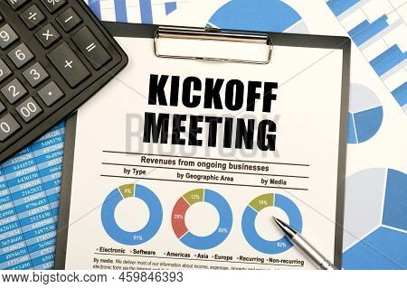 Business Concept. Against The Background Of Charts And Graphs, There Are Office Items And A Tablet W
