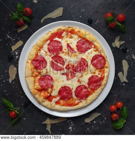 Traditional Italian Pizza With Italian Salami And Mozzarella Cheese