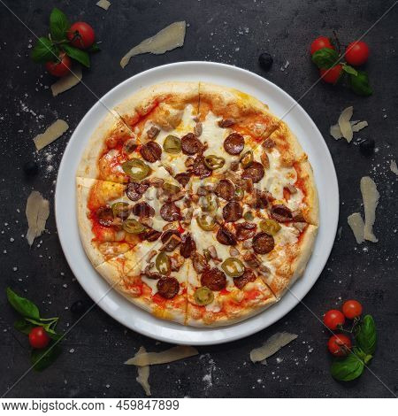 Traditional Italian Pizza With Sasauges And Roasted Rib