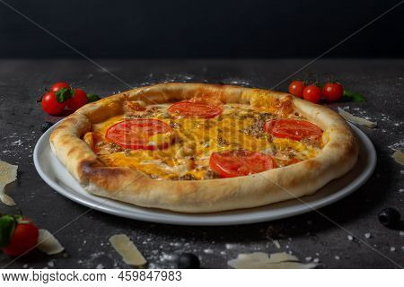 Italian Style Pizza With Tomato And Cheddar Cheese