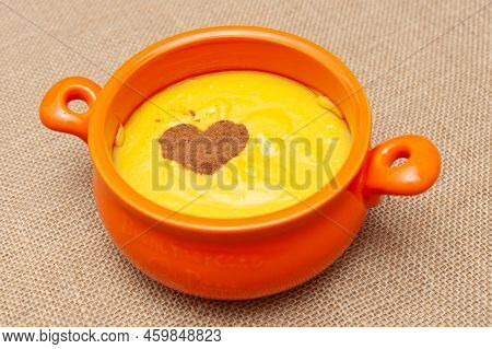 Homemade Sweet Corn Pudding Known In Brazil As Curau Or Canjica Nordestina In Ceramic Bowl. Powdered