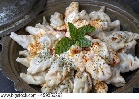 Traditional Manti Food On Plate, Top View. The Concept Of Oriental Cuisine. Uzbek Food Manty Dumplin