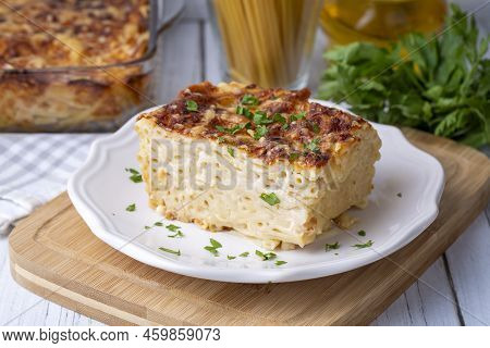 Pasta Casserole Bechamel Sauce Topped With Melted Mozzarella Cheese And Served In A White Baking Dis