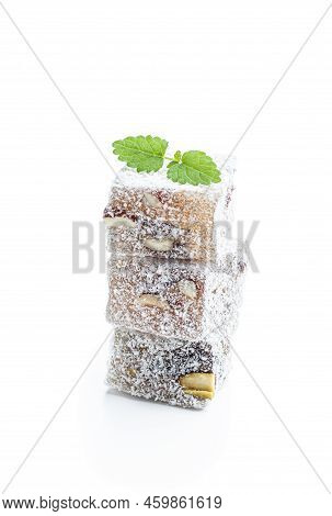 Turkish  Delight With Phistachio And Almond Covered With Coconut Isolated On White