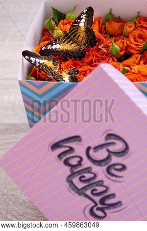Lovely Tropical Butterflies In A Box Of Roses. Orange Roses And Butterflies. Unusual And Stylish Bou