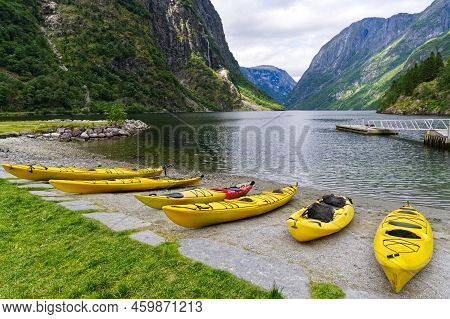 Sea Kayak (touring Kayak) In A Fjord In Norway, Scandinavia Pulled Ashore