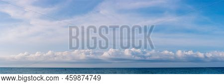 Banner Panorama Real Photo Natural Cloudscape Wallpaper. Beautiful White Fluffy Cumulus Clouds Summe