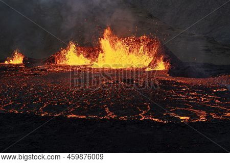 Volcano Eruption At Meradalir Near Fagradalsfjall, Iceland. Erupting Magma And Flowing Lava At Night