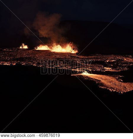 Volcano Eruption At Meradalir Near Fagradalsfjall, Iceland. Erupting Magma And Flowing Lava At Night