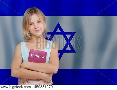 Cute Blonde Teen Girl Embracing Book With Inscription Hebrew In Hebrew Language On Flag Of Israel Ba