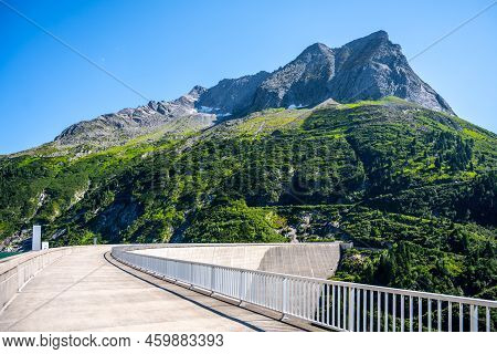 Huge Concrete Apline Dam On Sunny Summer Day. Zillergrundl Speicher, Zillertal Alps, Austria