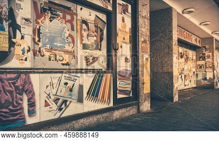 Mannheim, Germany - June 11, 2022: Old Flyers And Avertising Posters On Empty Whowcase Window Of Dil