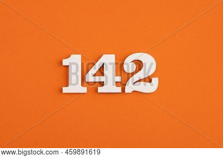 White Wooden Number 142 On Eva Rubber Orange Background