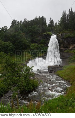 Water From The Fosselva River Drops Down The 50 M High Powerful Steindalsfossen, Norway