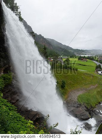 Water From The Fosselva River Drops Down The 50 M High Powerful Steindalsfossen, Norway