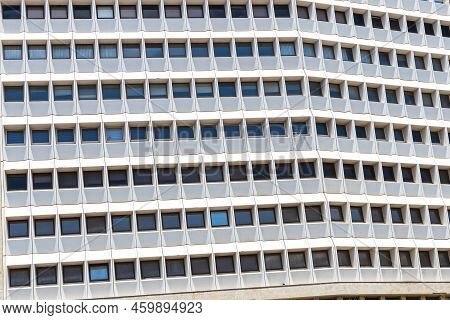 A Fragment Of The Glass And Sandstone Facade Of A Modern Office Building. Wide Abstract Fragment Of 