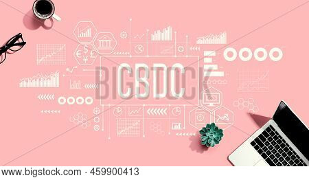 Cbdc - Central Bank Digital Currency Concept With A Laptop Computer On A Pink Background