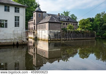 Lier, Antwerp Province, Belgium - 07 08 2022 - Historical Abbey Buildings Reflecting In The Water