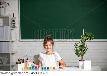 Child Girl Drawing With Coloring Pens Paintind. Portrait Of Adorable Little Girl Smiling Happily Whi
