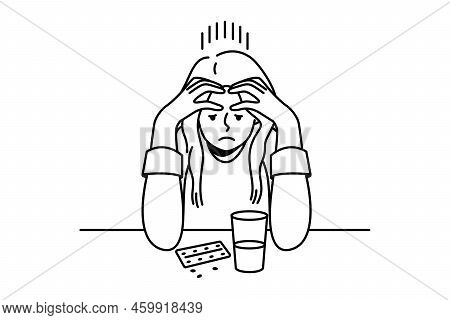 Frustrated Young Woman Sit At Desk Thinking Of Taking Pills. Unhappy Confused Female Doubt About Med