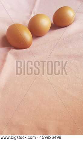 A Few Eggs On A Pink Cloth.