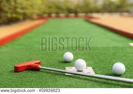 Mini-golf Ball On Artificial Grass. Summer Season Game