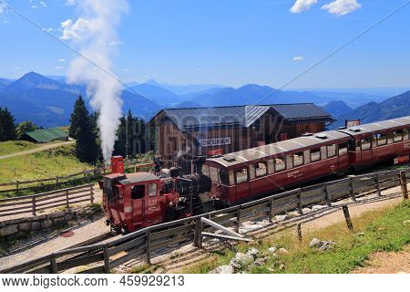 Schafberg, Austria - August 3, 2022: People Ride The Schafbergbahn Steam Train To The Top Of Mount S