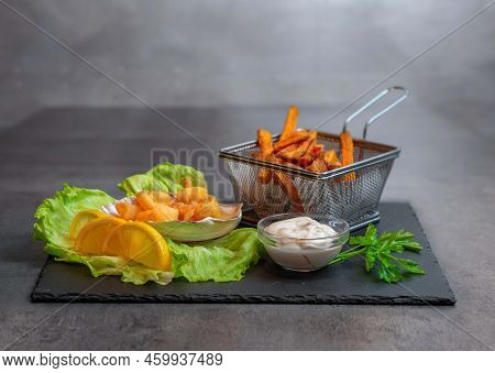 Fried Shrimps With Sweet Potatos In Gray Background