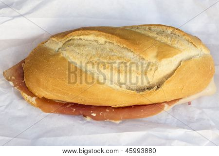 Spanish serrano ham sandwich on a napkin on a table
