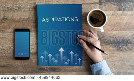 Aspiration Blue Book On Wooden Table With Black Coffee And Smart Phone To Concept Of Book Help To Gr