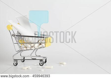 Titanium Dioxide, E171, Dangerous Additive Concept. Gum, Pills, Toothpaste, Cream In Basket And Sign