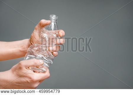 Raised Hands Holding Crumpled Plastic Bottle Hand Squeeze Bottle Water Plastic Recycle Reuse Reduce 