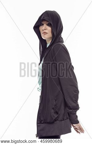 Sportive Caucasian Female Athlete Posing In Black Hoody And Sexy Fitness Outfit While Posing With Cr