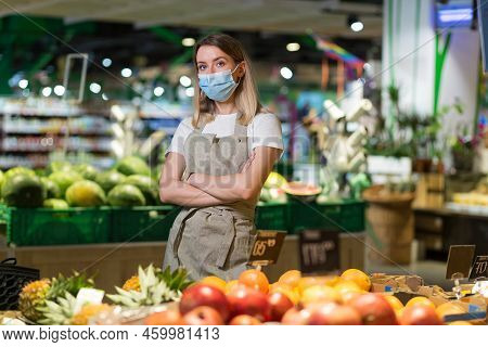 Portrait Young Woman Worker Seller In A Vegetable Section Supermarket Standing In A Protected Face M
