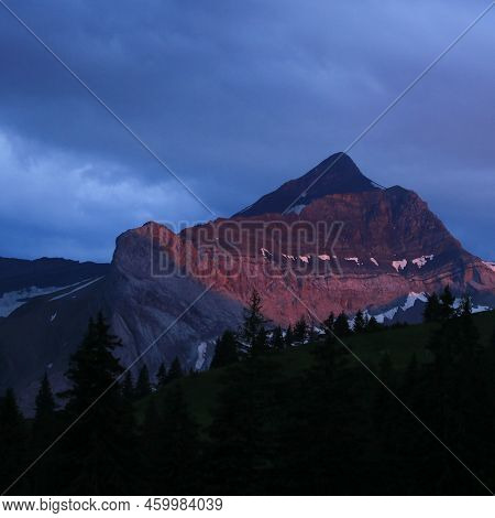 Red Lit Peak Of Mount Oldehore, Mountain In The Swiss Alps.