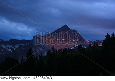 Peak Of Mount Oldehore At Sunset. Mountain Near Gstaad.