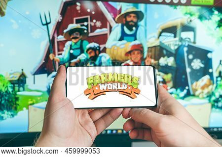 Russia Moscow 25.12.2021 Logo Of Farmers World. Blockchain Nft Ethereum Cryptocurrency Strategy Game