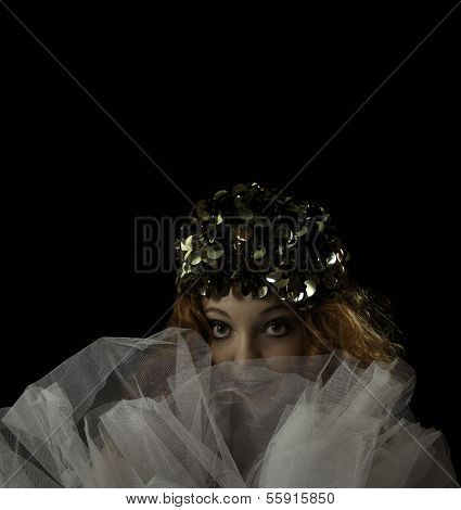 Beautiful woman with red hair wearing vintage hat