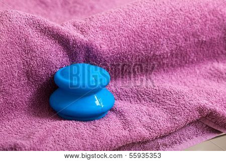 Blue Rubber Cupping On Pink Towel For Vacuum Massage