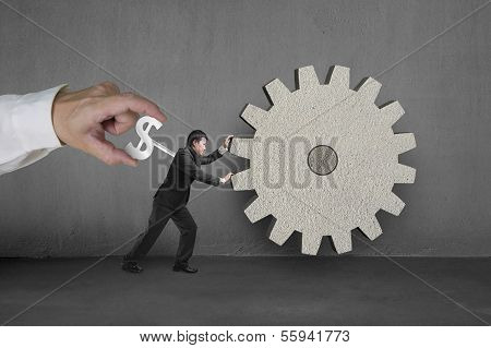 Hand Winding Winder On Businessman To Work On Concrete Gear